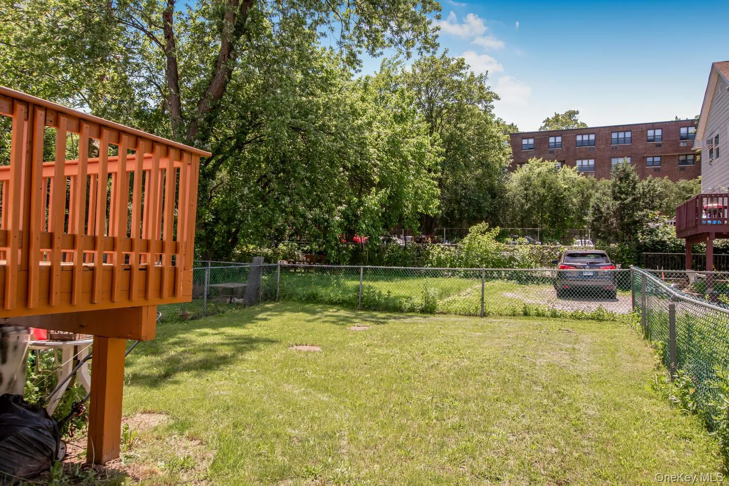 View of yard featuring a wooden deck View of yard featuring a wooden deck
