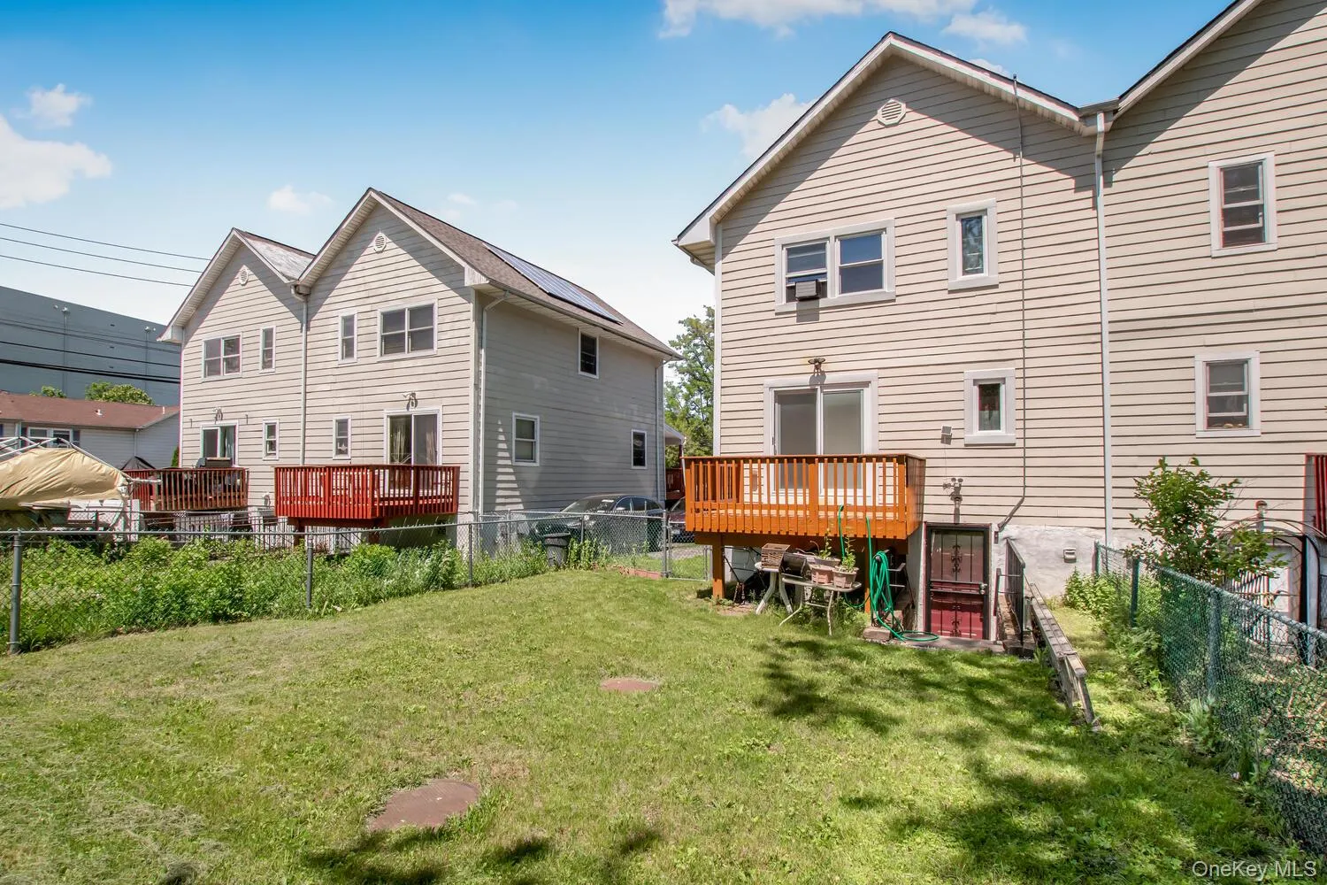 Back of property with a wooden deck Back of property with a wooden deck