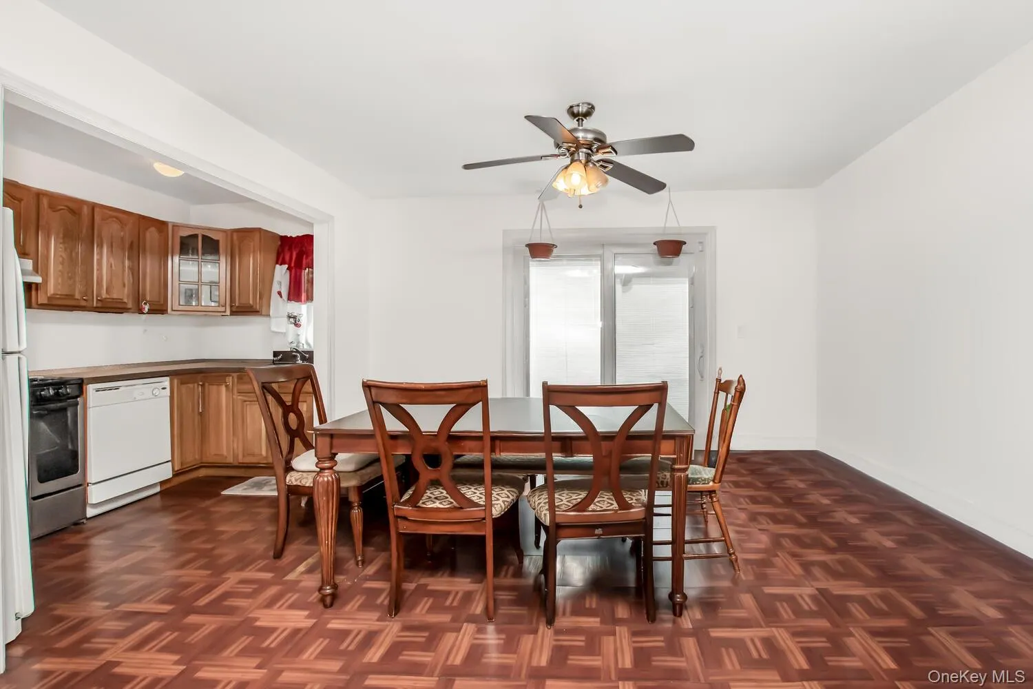 Dining space featuring ceiling fan and baseboards Dining space featuring ceiling fan and baseboards