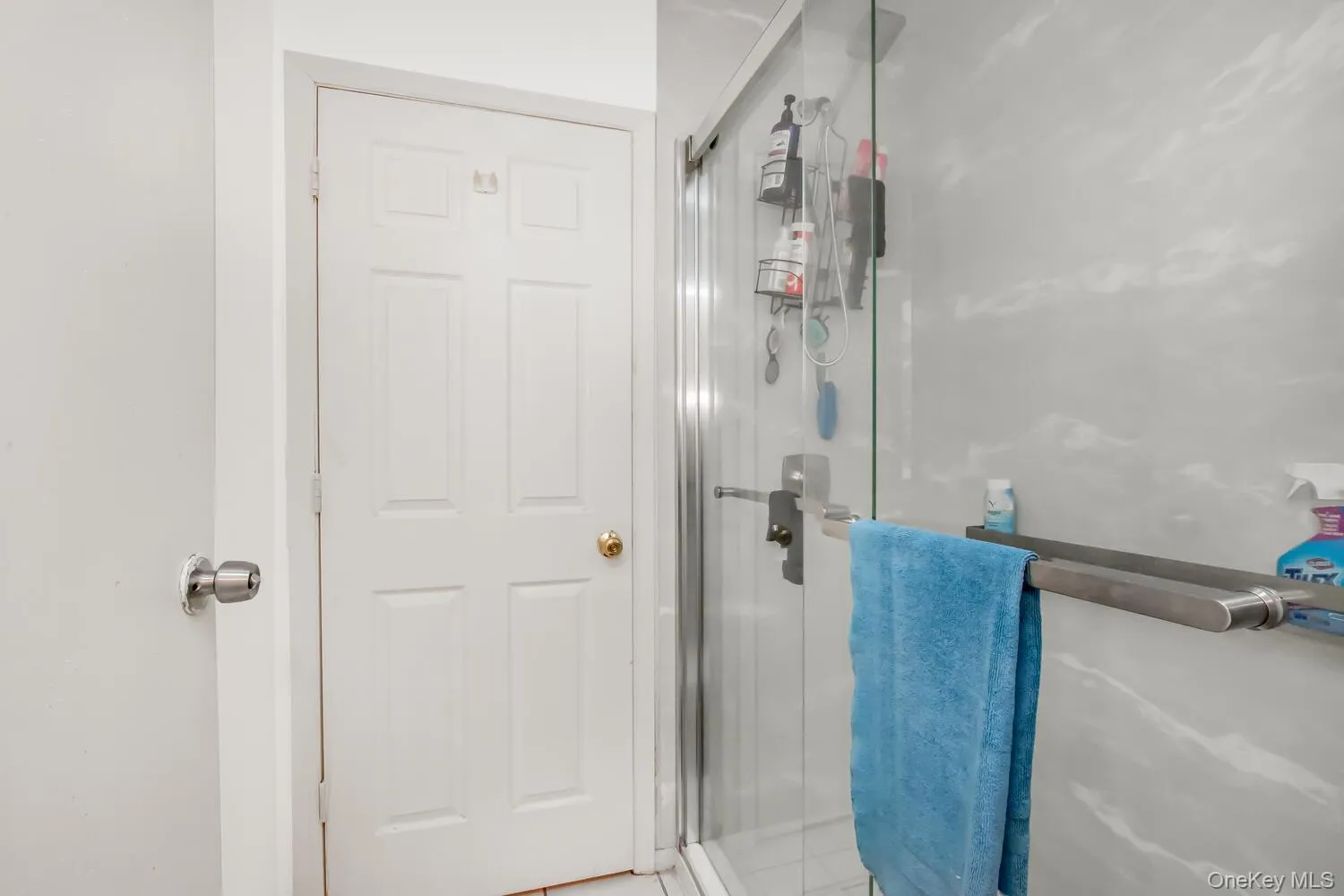 Full bathroom with a shower stall Full bathroom with a shower stall