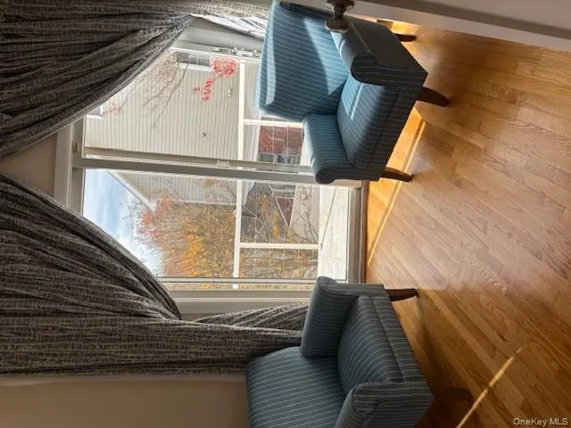Sitting room featuring light wood-style flooring Sitting room featuring light wood-style flooring