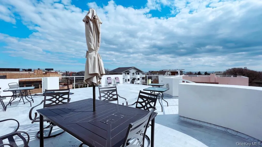 View of patio featuring outdoor dining area View of patio featuring outdoor dining area