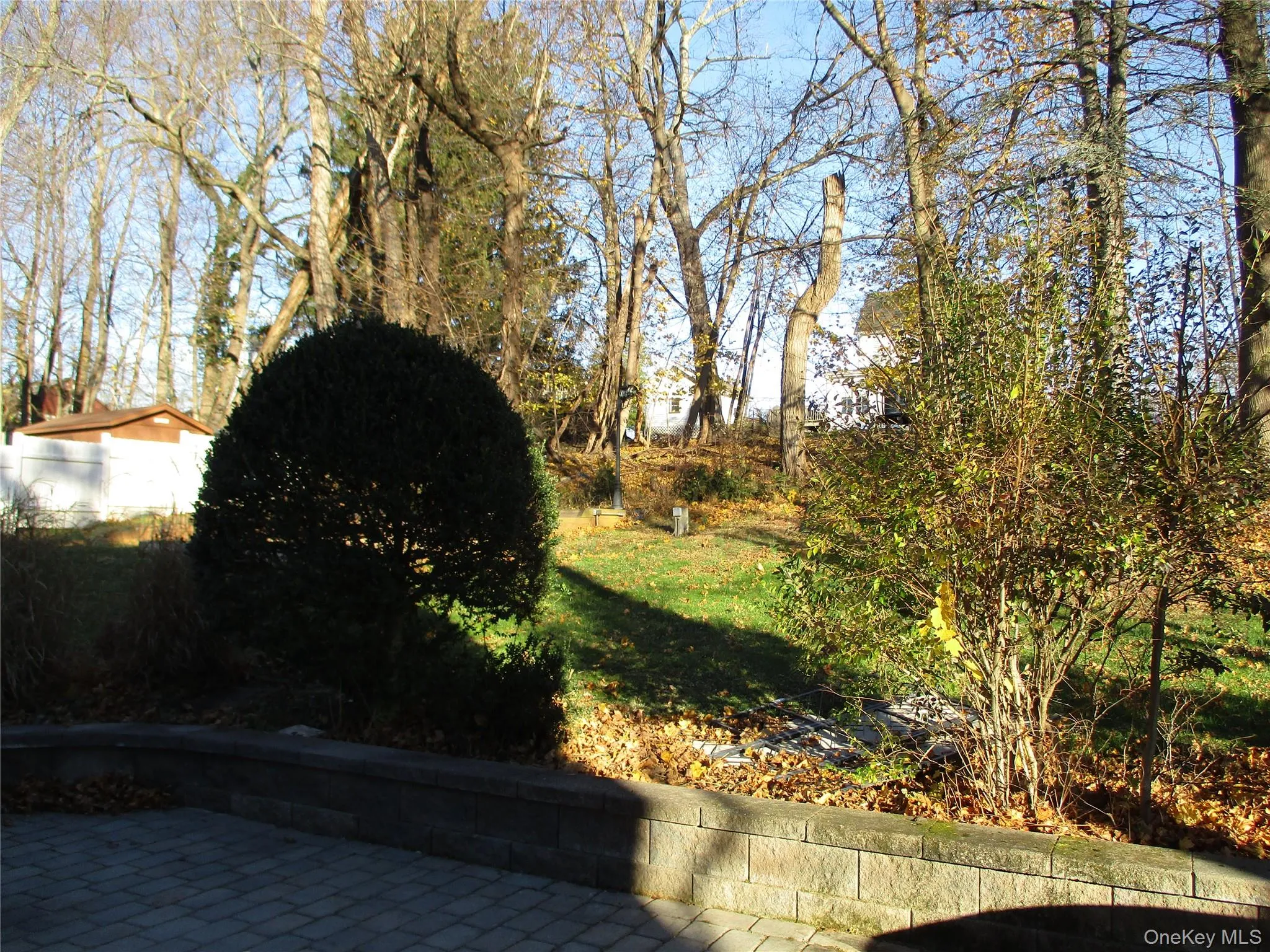 View of grassy yard with a patio area View of grassy yard with a patio area