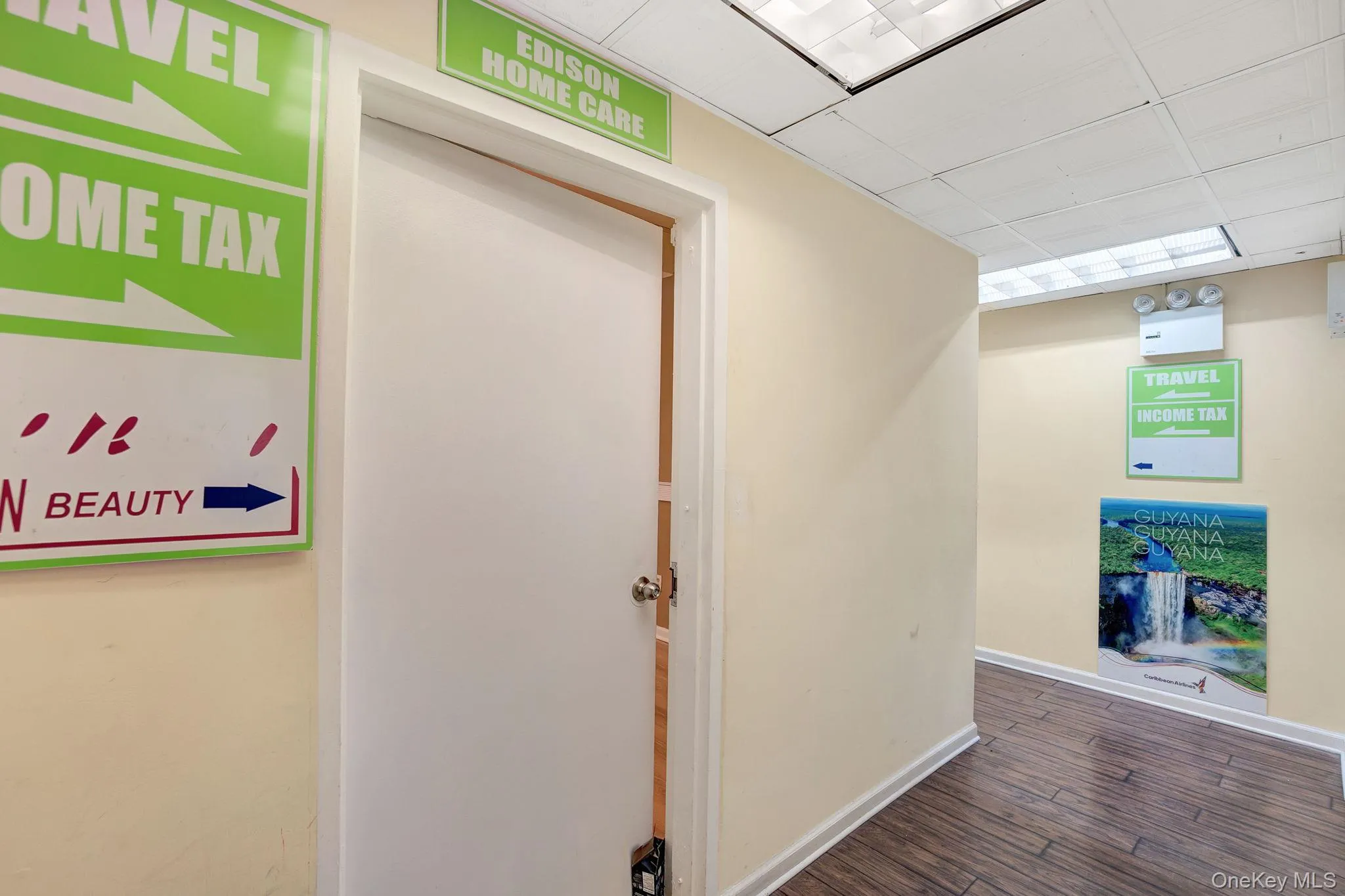 Hall with baseboards and dark wood-style floors Hall with baseboards and dark wood-style floors