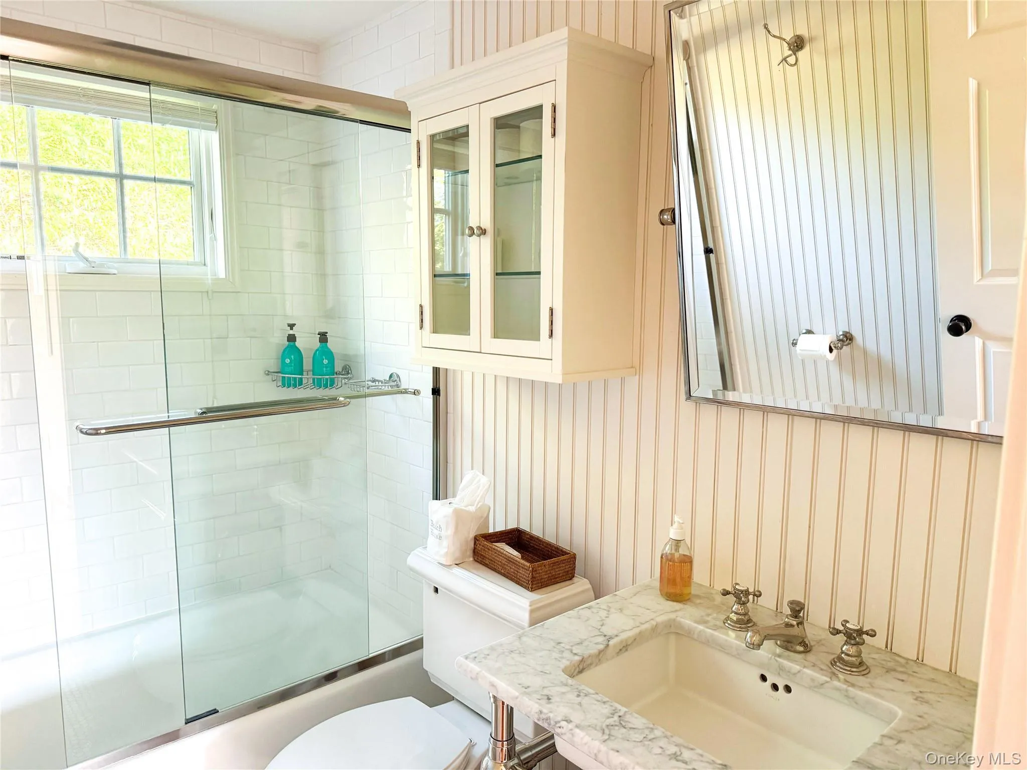 Full bath featuring vanity and bath / shower combo with glass door Full bath featuring vanity and bath / shower combo with glass door