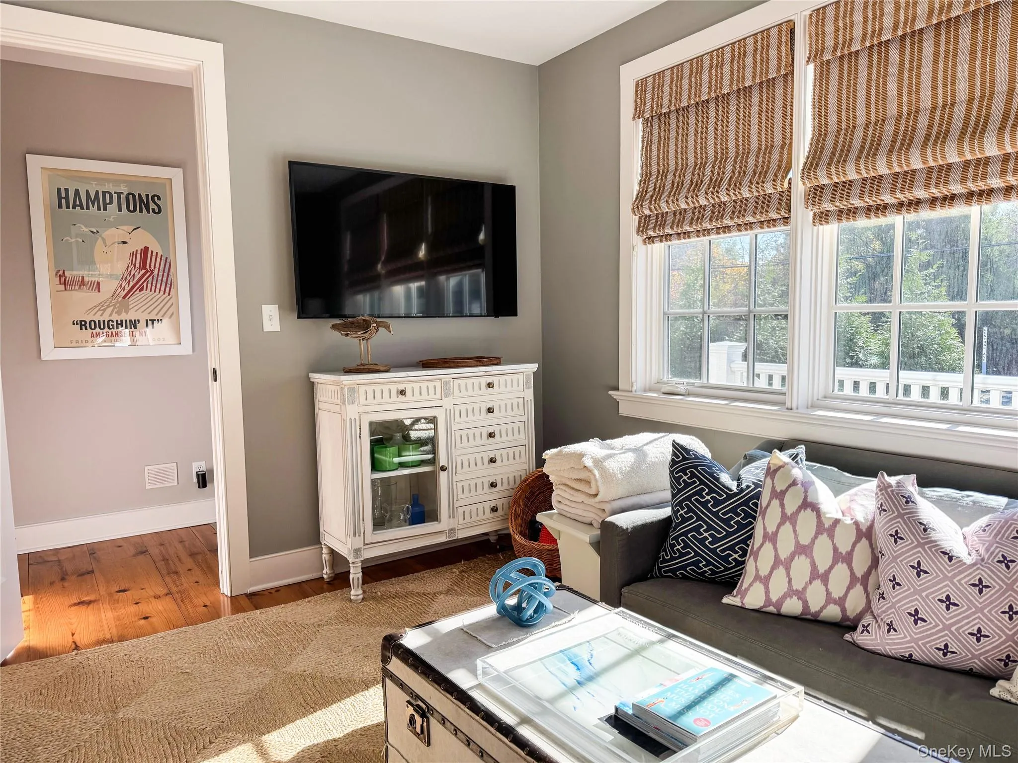 Living room with wood finished floors and baseboards Living room with wood finished floors and baseboards