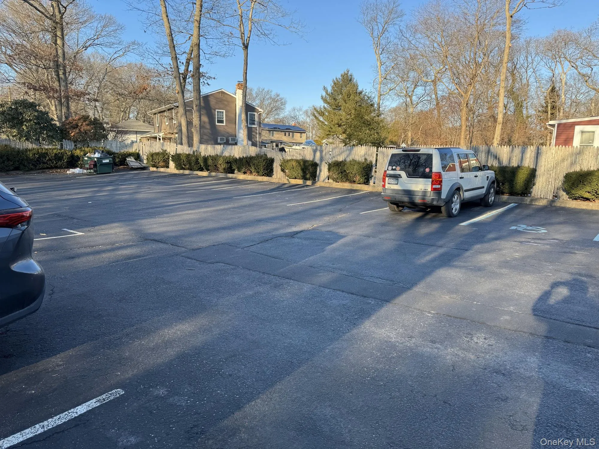 Uncovered parking lot with a residential view Uncovered parking lot with a residential view