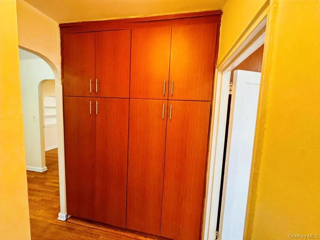 Detailed view of arched walkways and wood finished floors Detailed view of arched walkways and wood finished floors