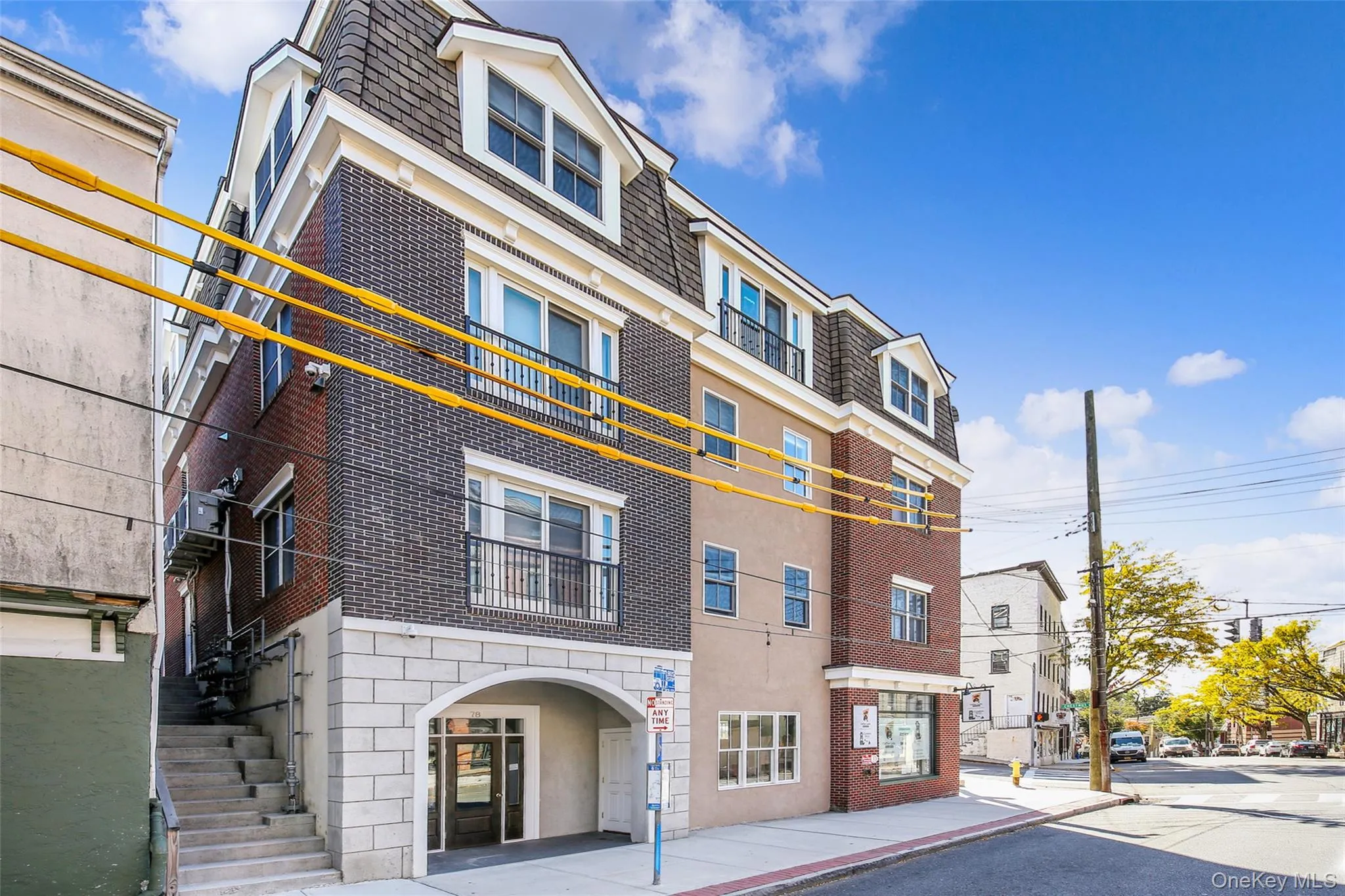 View of property with stairs View of property with stairs
