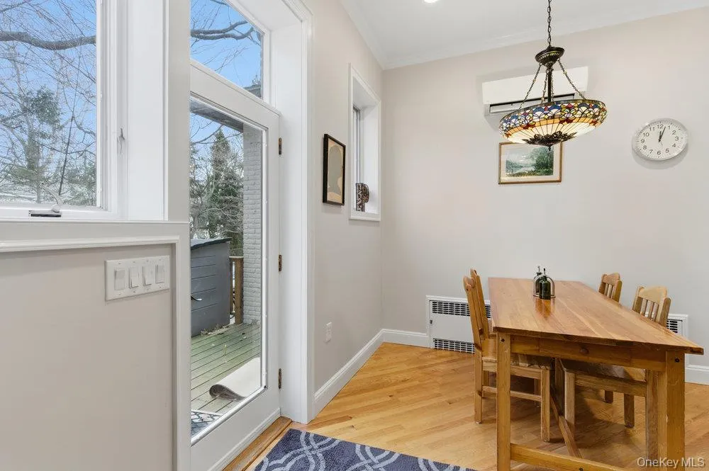 Light filled Dining area featuring hardwood floors Light filled Dining area featuring hardwood floors