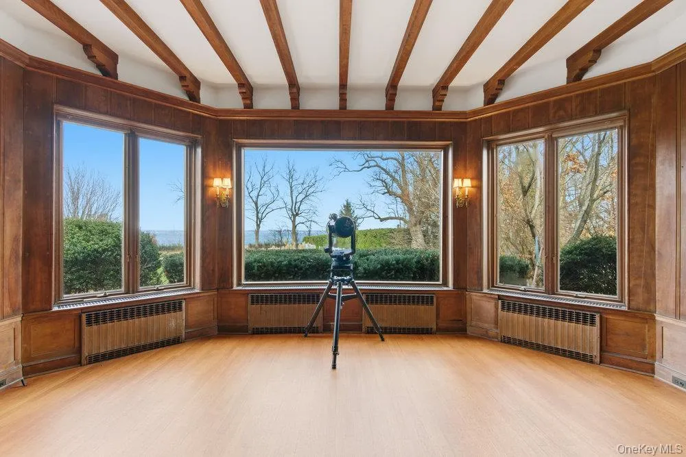 Formal living room overlooking backyard and Long Island Sound Formal living room overlooking backyard and Long Island Sound