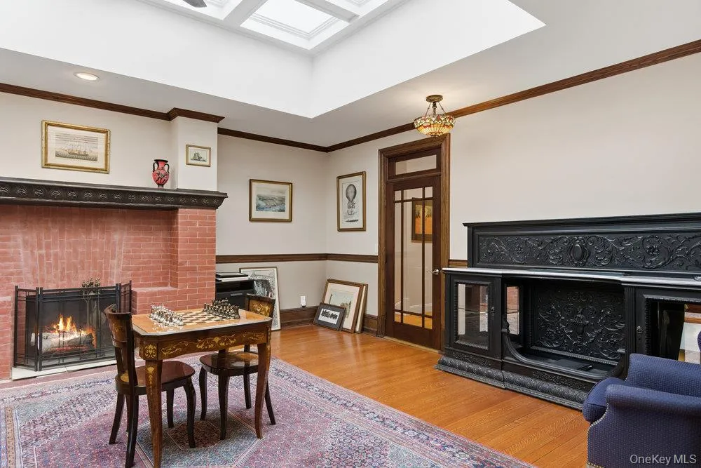 Gallery with atrium skylight, fireplace & original oak floors Gallery with atrium skylight, fireplace & original oak floors