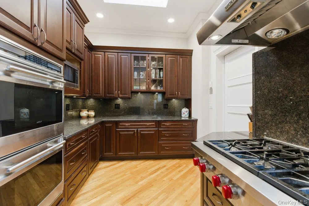 Kitchen featuring 6 burner propane wolf cooktop, wolf double wall oven and sub zero refrigerator Kitchen featuring 6 burner propane wolf cooktop, wolf double wall oven and sub zero refrigerator