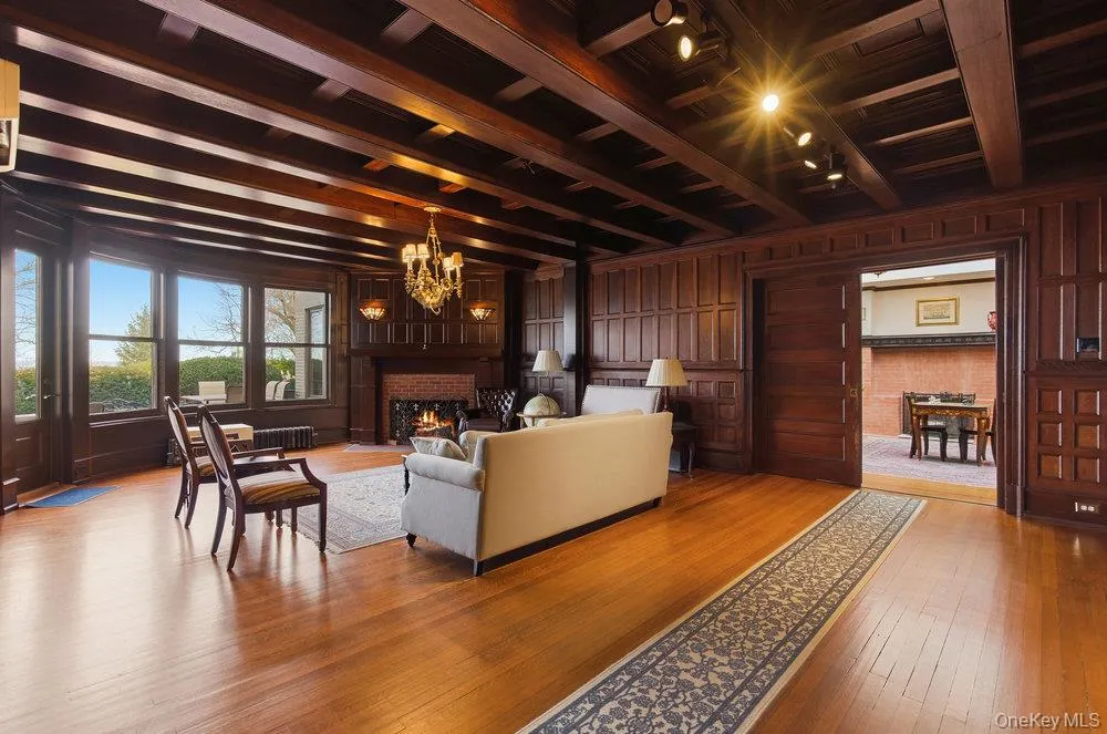 Parlor with fireplace, all original wood details and beamed ceiling Parlor with fireplace, all original wood details and beamed ceiling