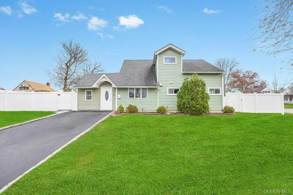 View of front of house featuring roof with shingles and asphalt driveway View of front of house featuring roof with shingles and asphalt driveway