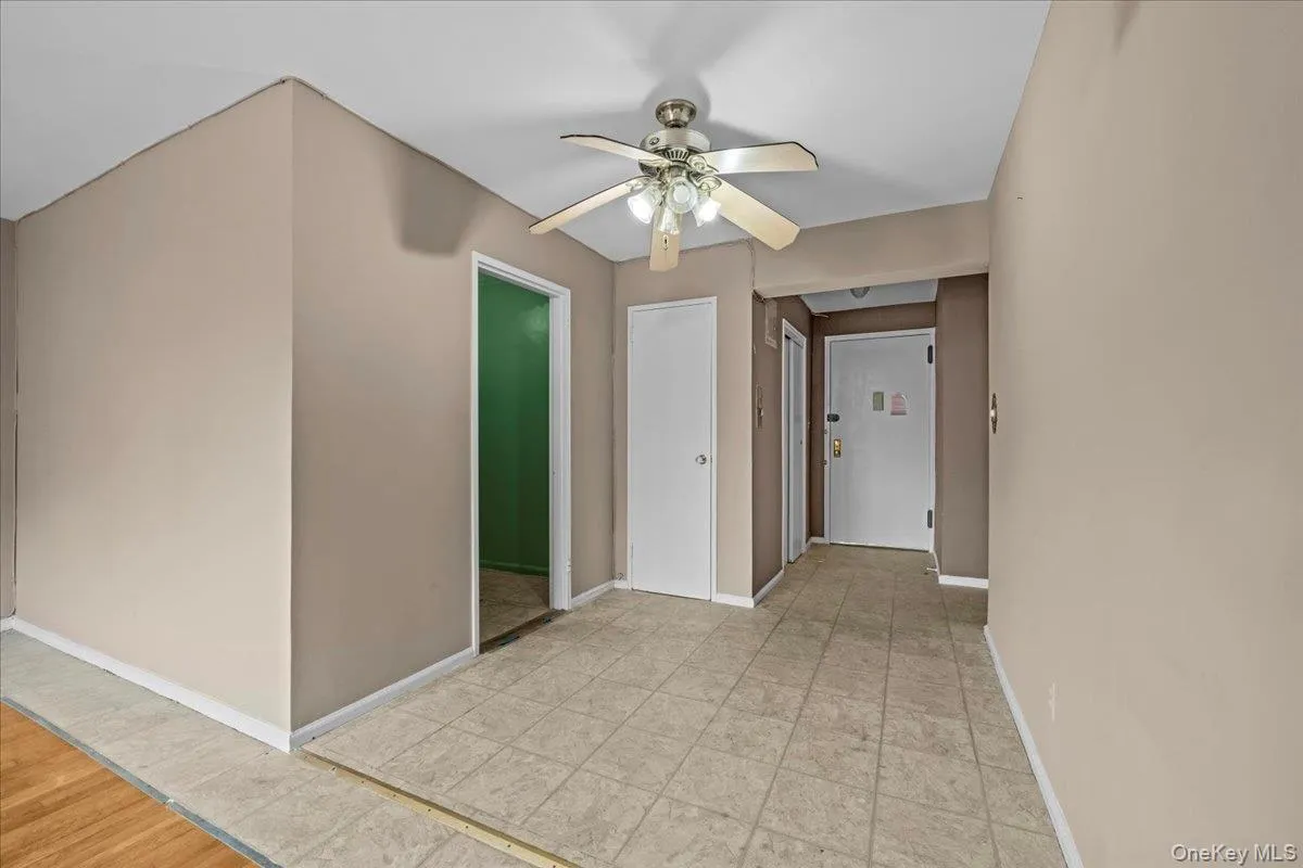 Corridor featuring baseboards Corridor featuring baseboards