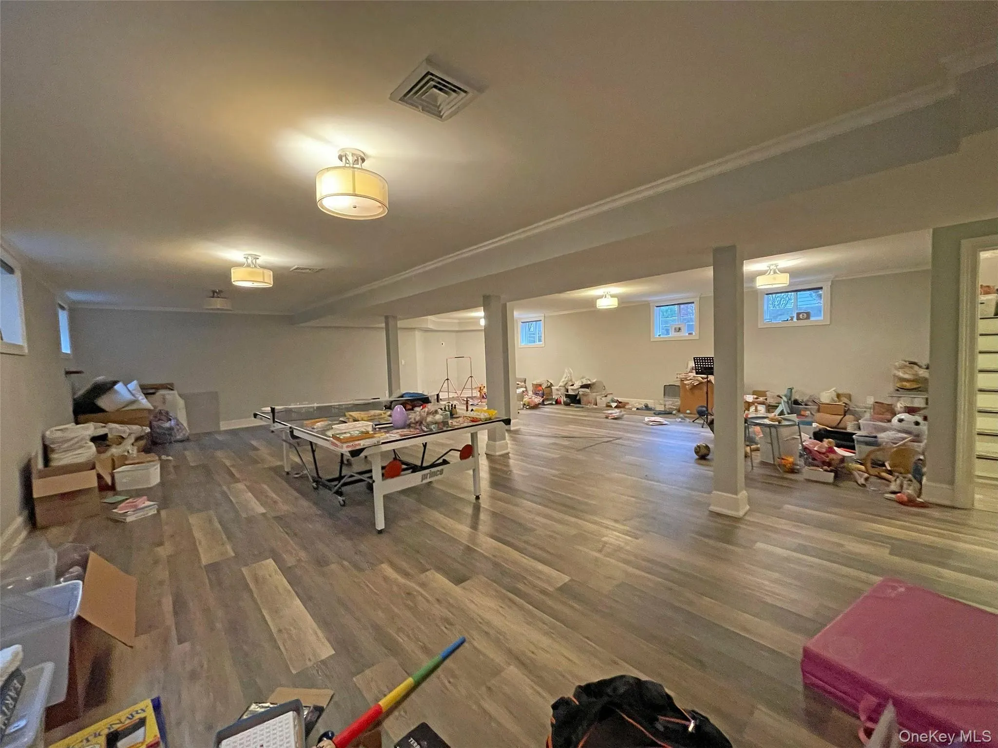 Very spacious Game room with finished floors and crown molding Very spacious Game room with finished floors and crown molding