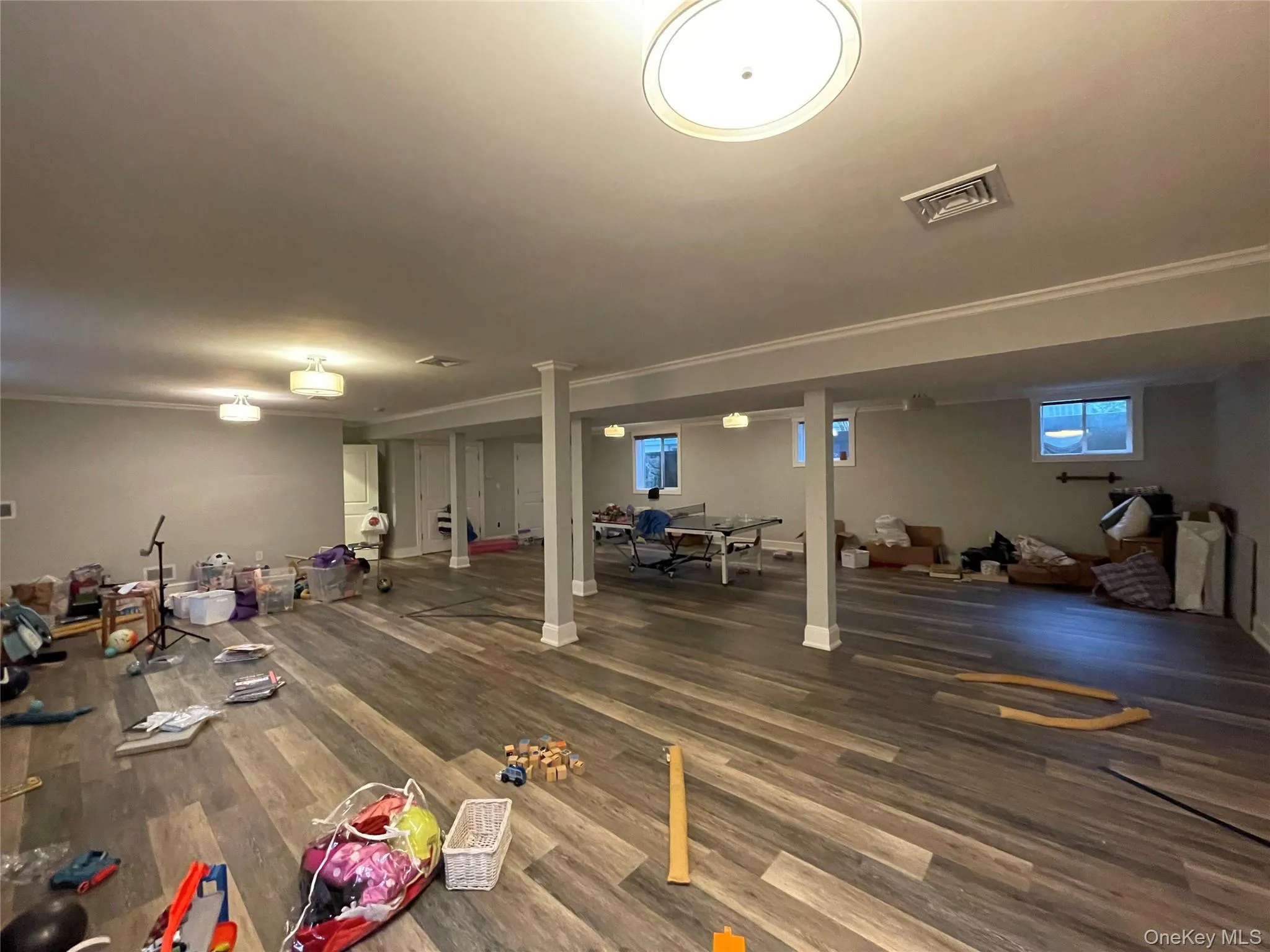 Basement with dark wood-style flooring Basement with dark wood-style flooring