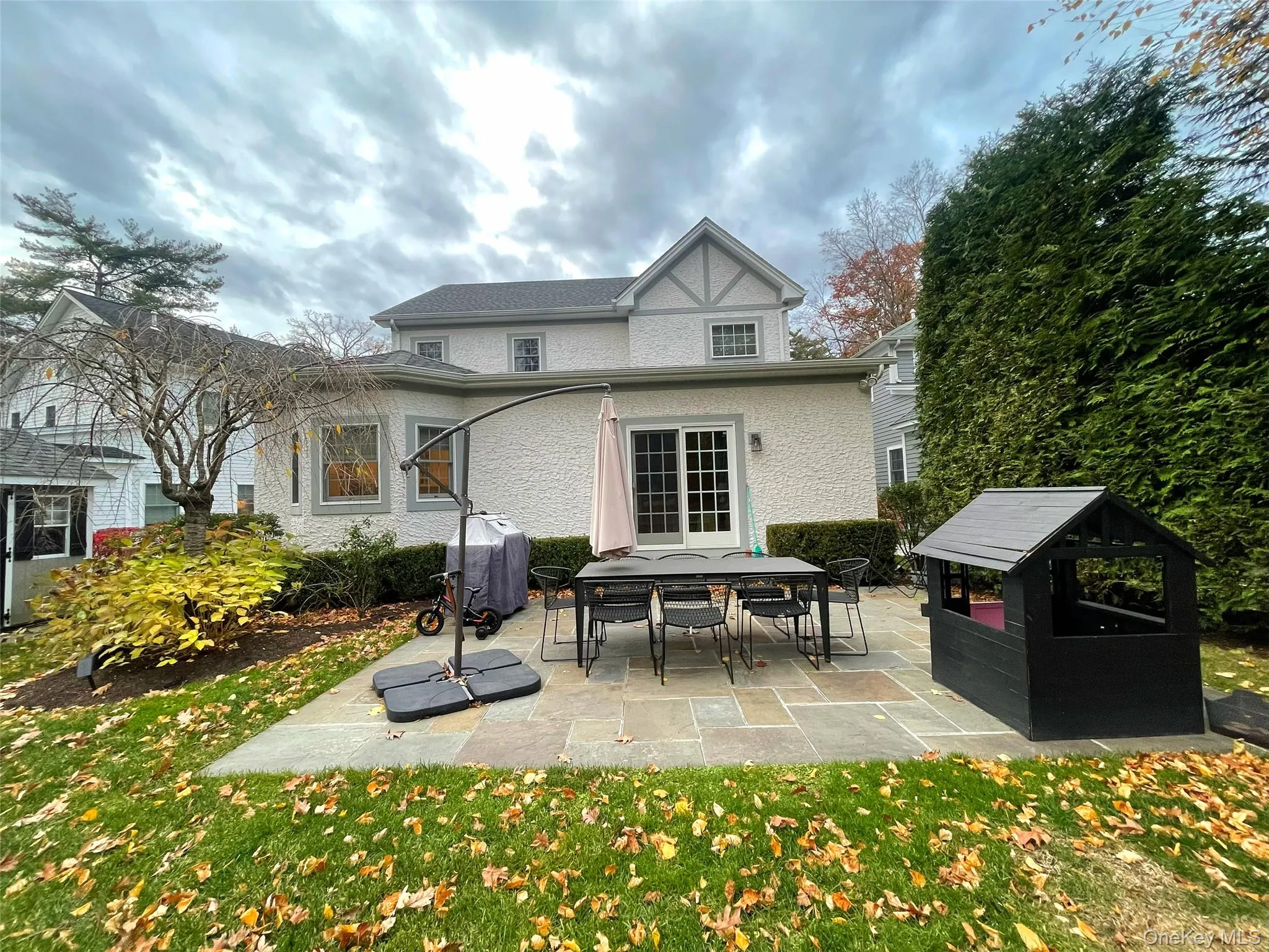 Rear view of property with a patio and a yard Rear view of property with a patio and a yard