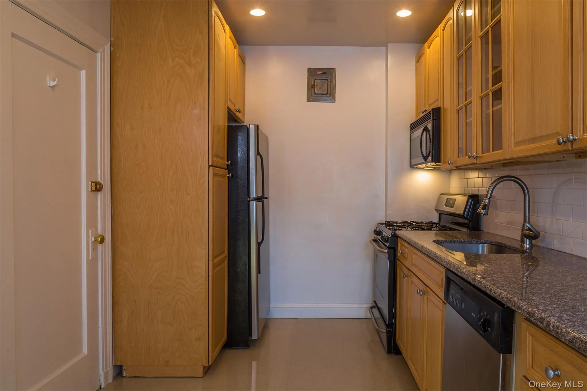 Kitchen featuring stainless steel appliances and granite counters Kitchen featuring stainless steel appliances and granite counters