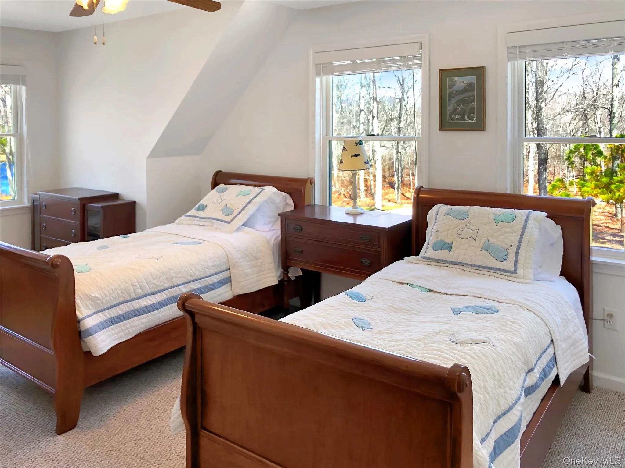 Bedroom featuring carpet flooring and a ceiling fan Bedroom featuring carpet flooring and a ceiling fan