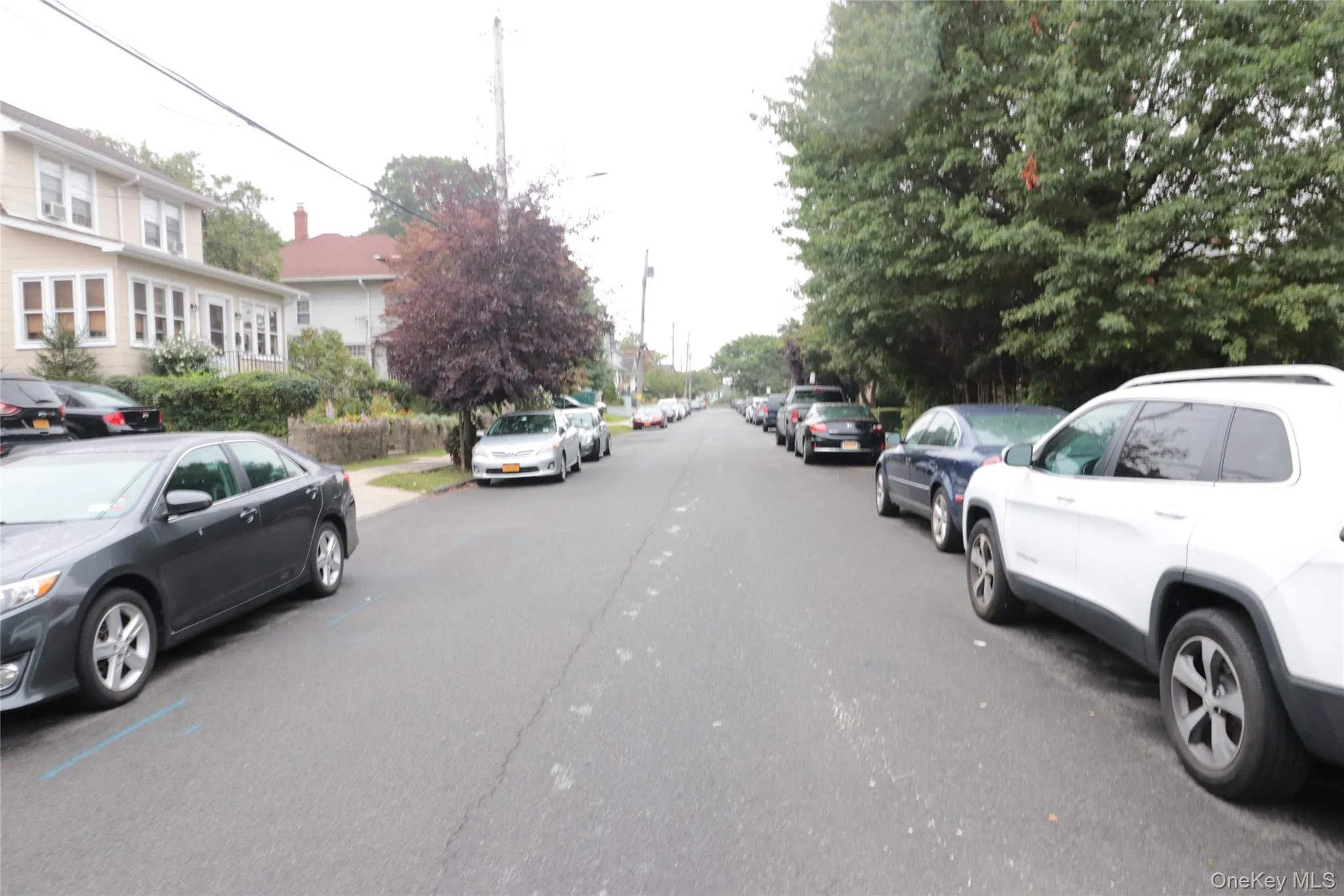 View of asphalt street featuring street lighting View of asphalt street featuring street lighting