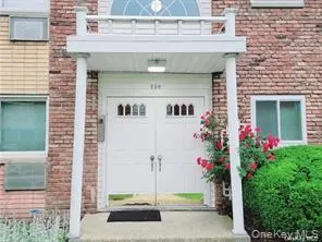 View of exterior entry featuring brick siding View of exterior entry featuring brick siding