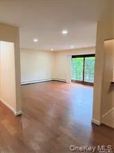 Unfurnished room with recessed lighting and dark wood-type flooring Unfurnished room with recessed lighting and dark wood-type flooring
