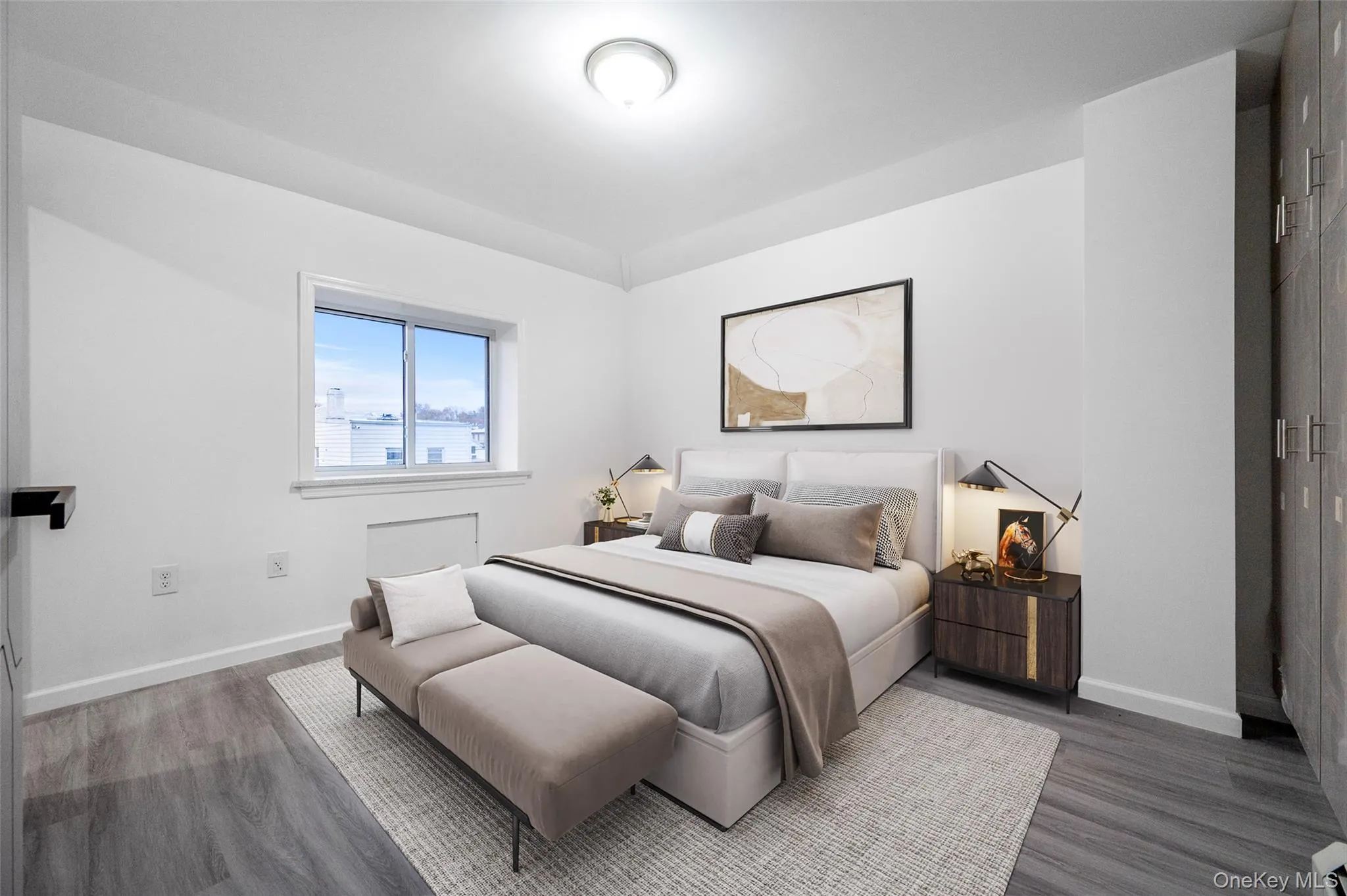 Bedroom with baseboards and wood finished floors Bedroom with baseboards and wood finished floors