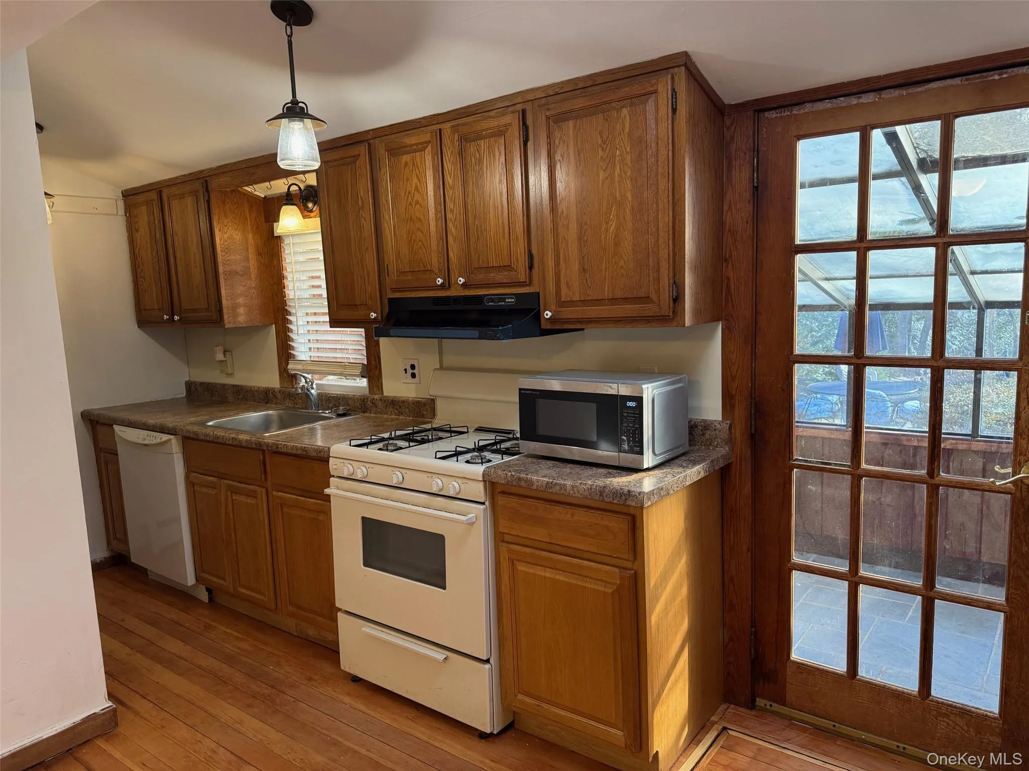 Door to Sunroom and Backyard Door to Sunroom and Backyard