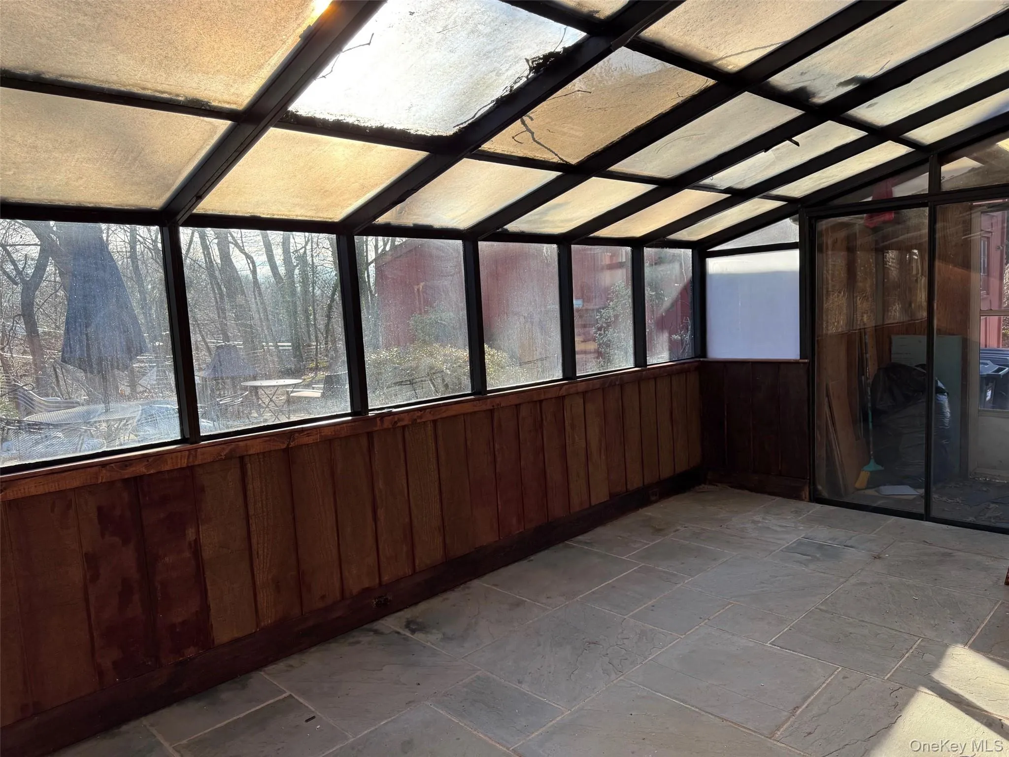 Sunroom with Door to Mudroom to Sideyard Sunroom with Door to Mudroom to Sideyard