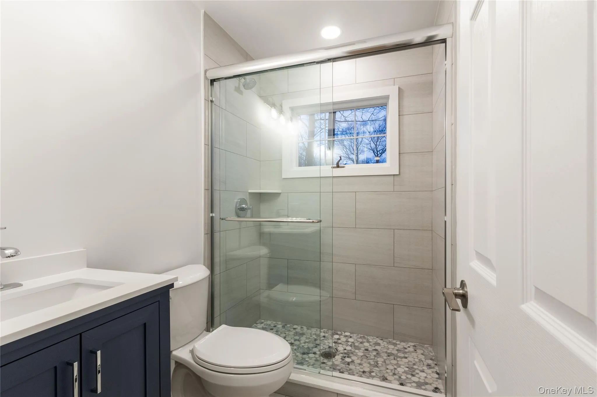 Bathroom featuring vanity and a stall shower Bathroom featuring vanity and a stall shower
