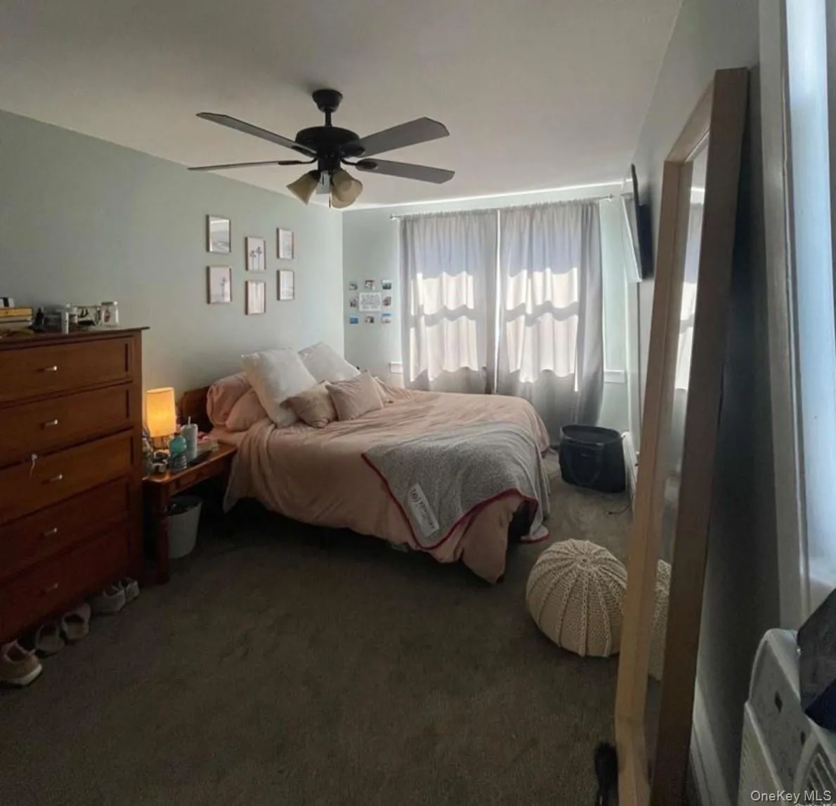Bedroom featuring carpet floors and ceiling fan Bedroom featuring carpet floors and ceiling fan