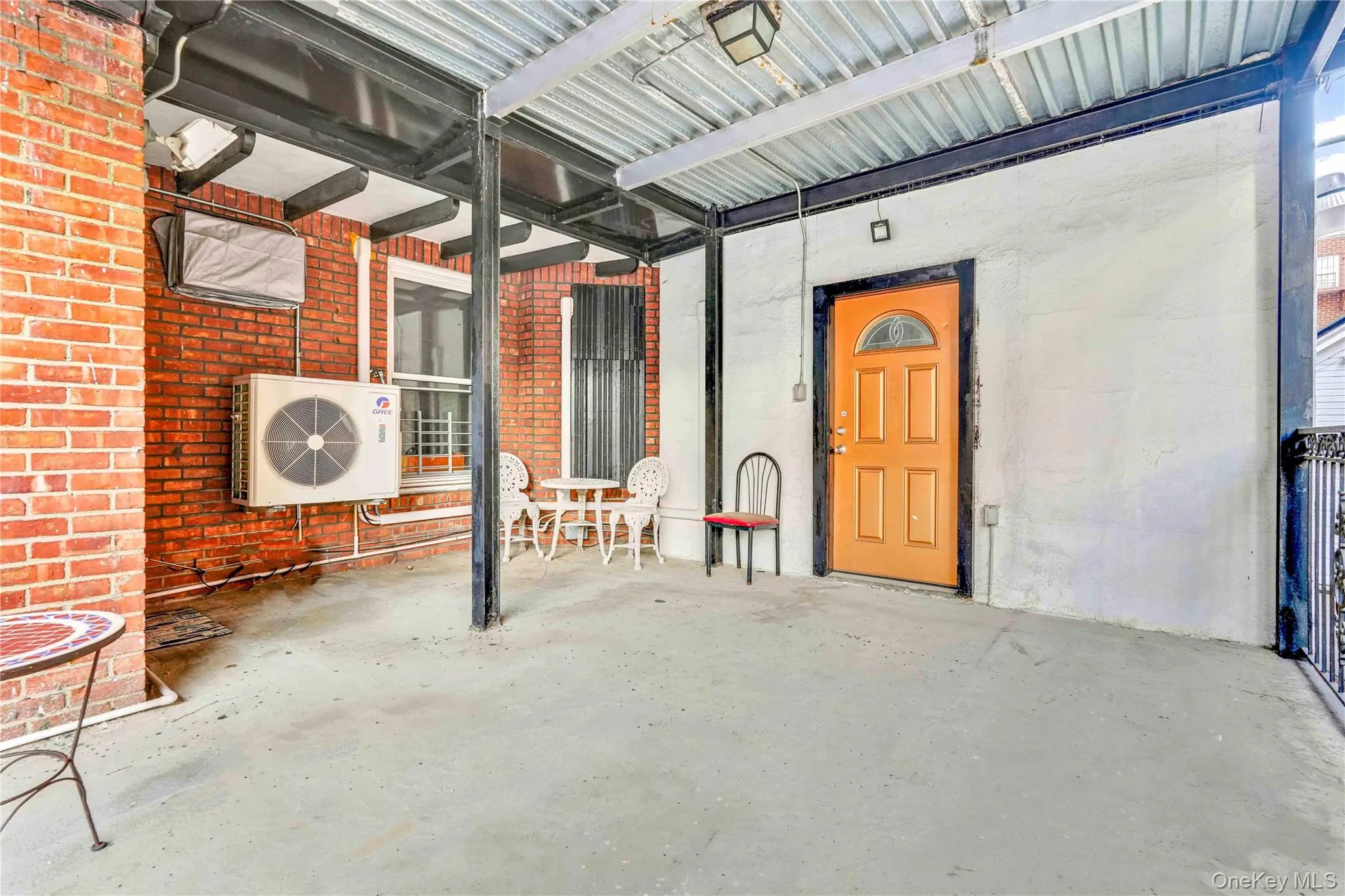Entrance to property with covered porch and brick siding Entrance to property with covered porch and brick siding