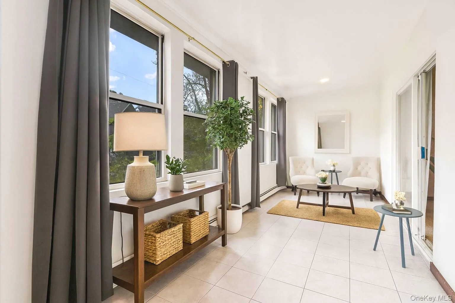 Hallway with light tile patterned floors and recessed lighting Hallway with light tile patterned floors and recessed lighting