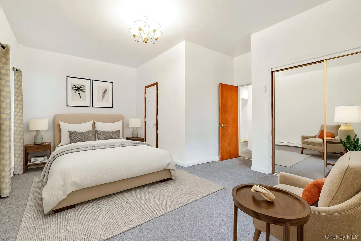 Carpeted bedroom with a chandelier and a closet Carpeted bedroom with a chandelier and a closet