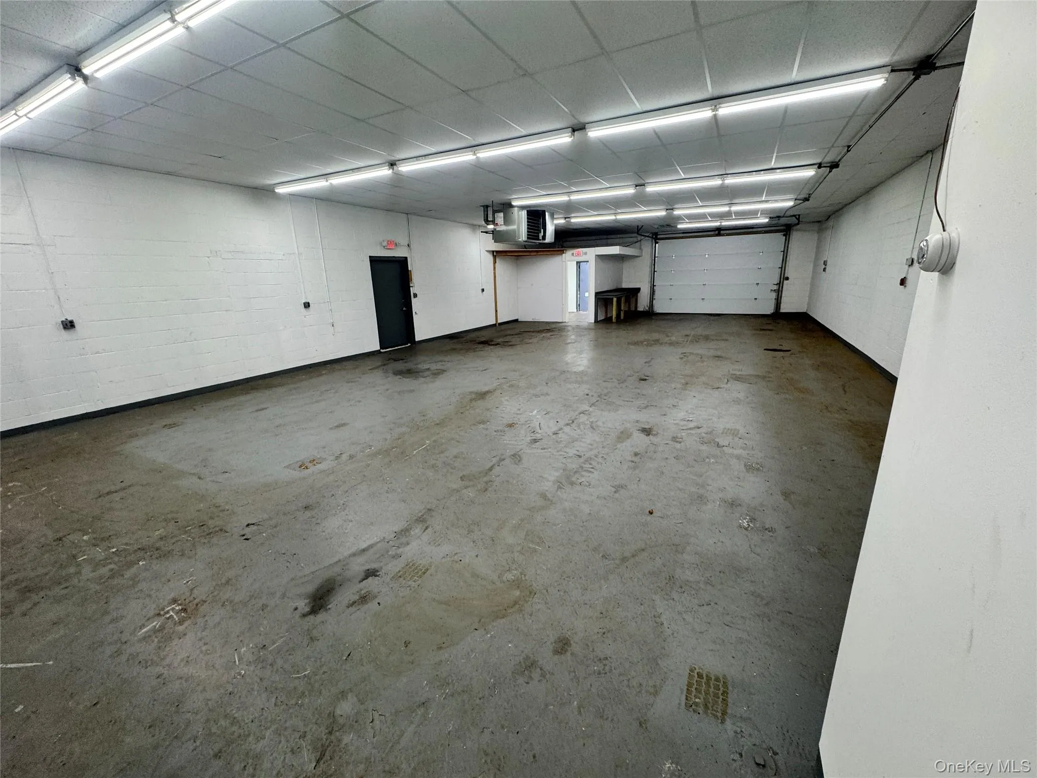 Garage with concrete block wall and a heating unit Garage with concrete block wall and a heating unit