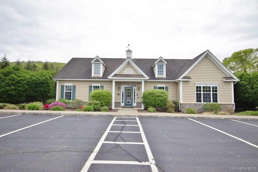 Clubhouse in front of pool Clubhouse in front of pool