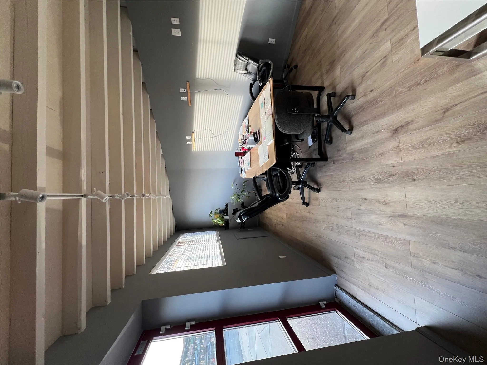 Dining space featuring beamed ceiling, a desk, and light wood-style floors Dining space featuring beamed ceiling, a desk, and light wood-style floors