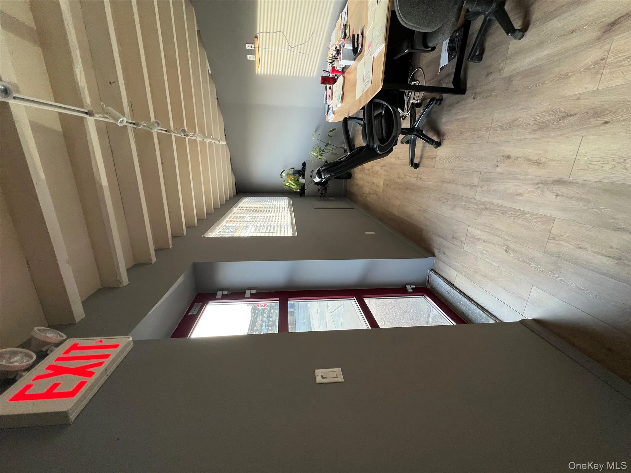 Office with beamed ceiling and light wood-style floors Office with beamed ceiling and light wood-style floors