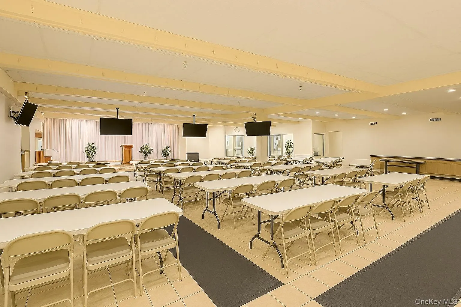 Dining space featuring beamed ceiling, light tile patterned floors, and recessed lighting Dining space featuring beamed ceiling, light tile patterned floors, and recessed lighting