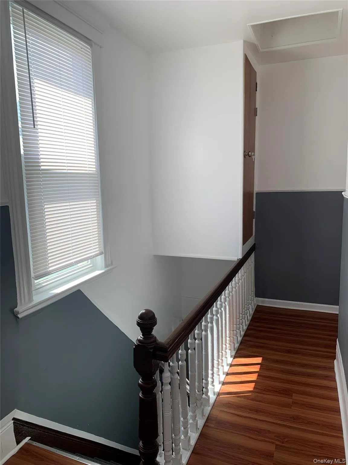 Stairway with wood finished floors and baseboards Stairway with wood finished floors and baseboards