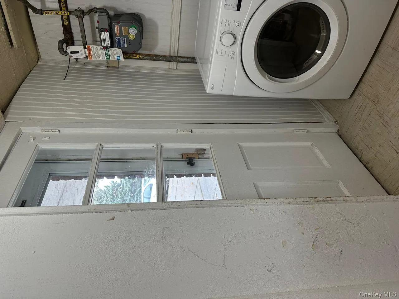 Laundry room featuring washer / clothes dryer and light floors Laundry room featuring washer / clothes dryer and light floors