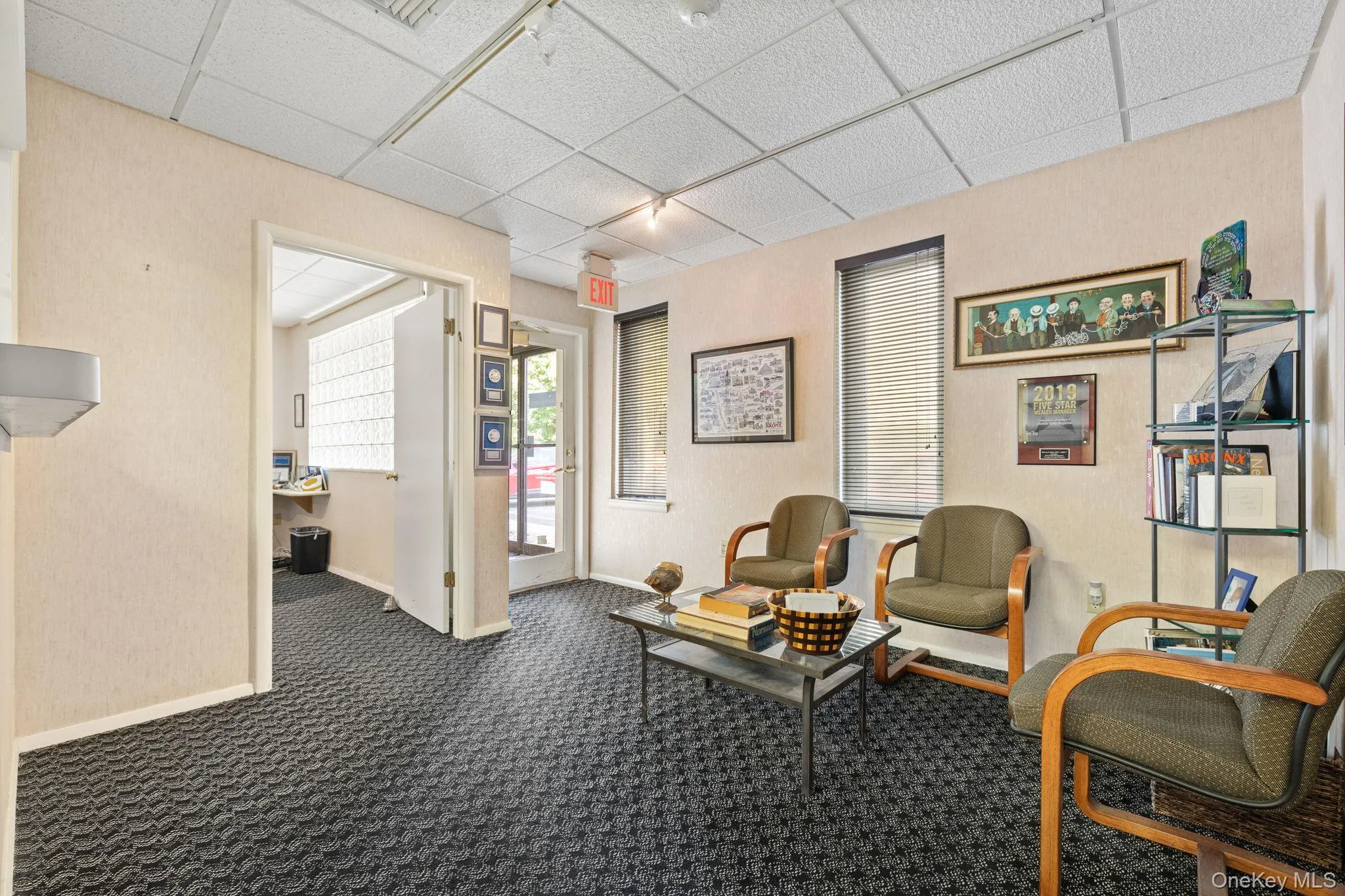 Common area with a paneled ceiling Common area with a paneled ceiling
