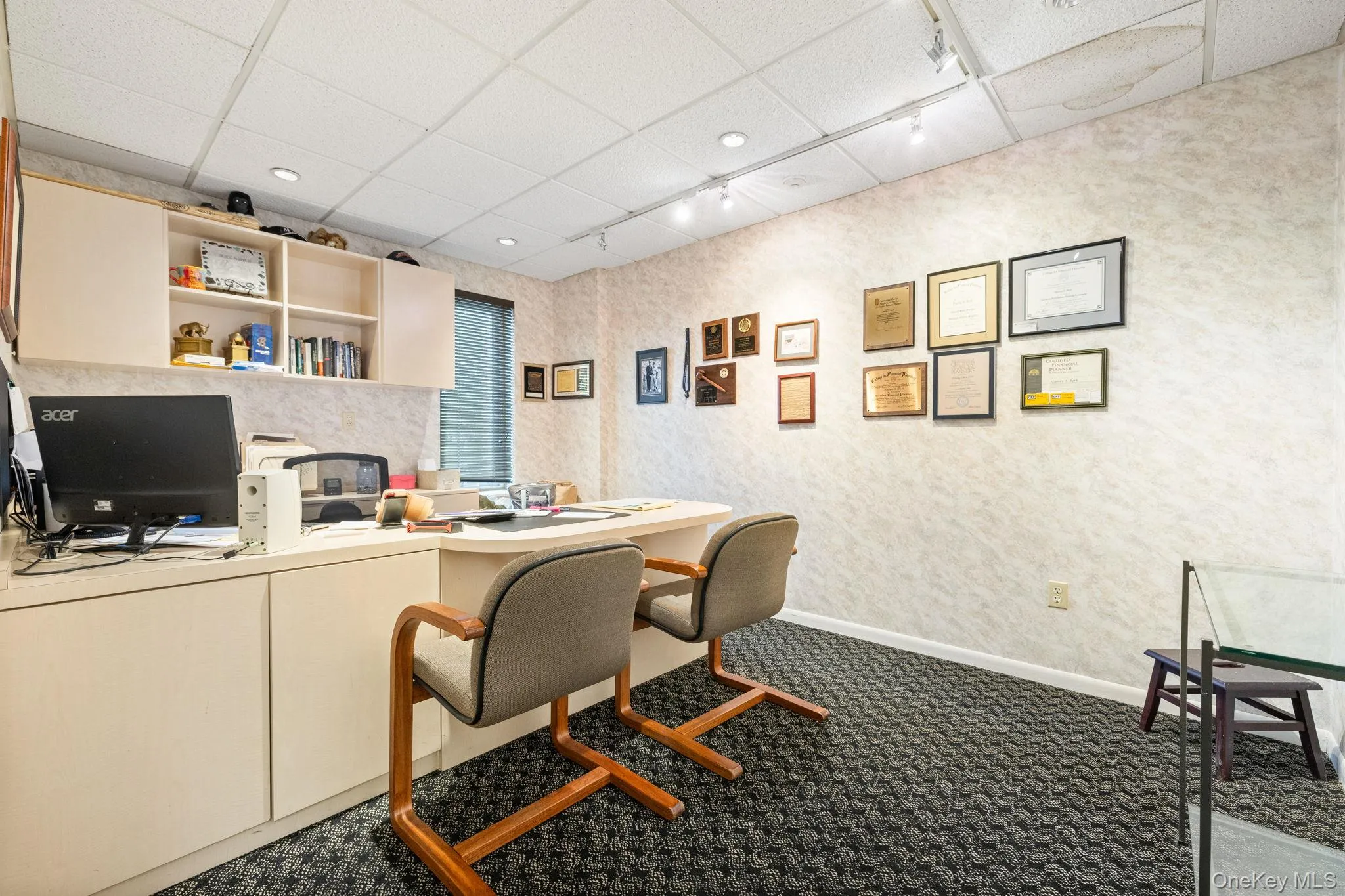 Home office with a drop ceiling, track lighting, dark carpet, and recessed lighting Home office with a drop ceiling, track lighting, dark carpet, and recessed lighting