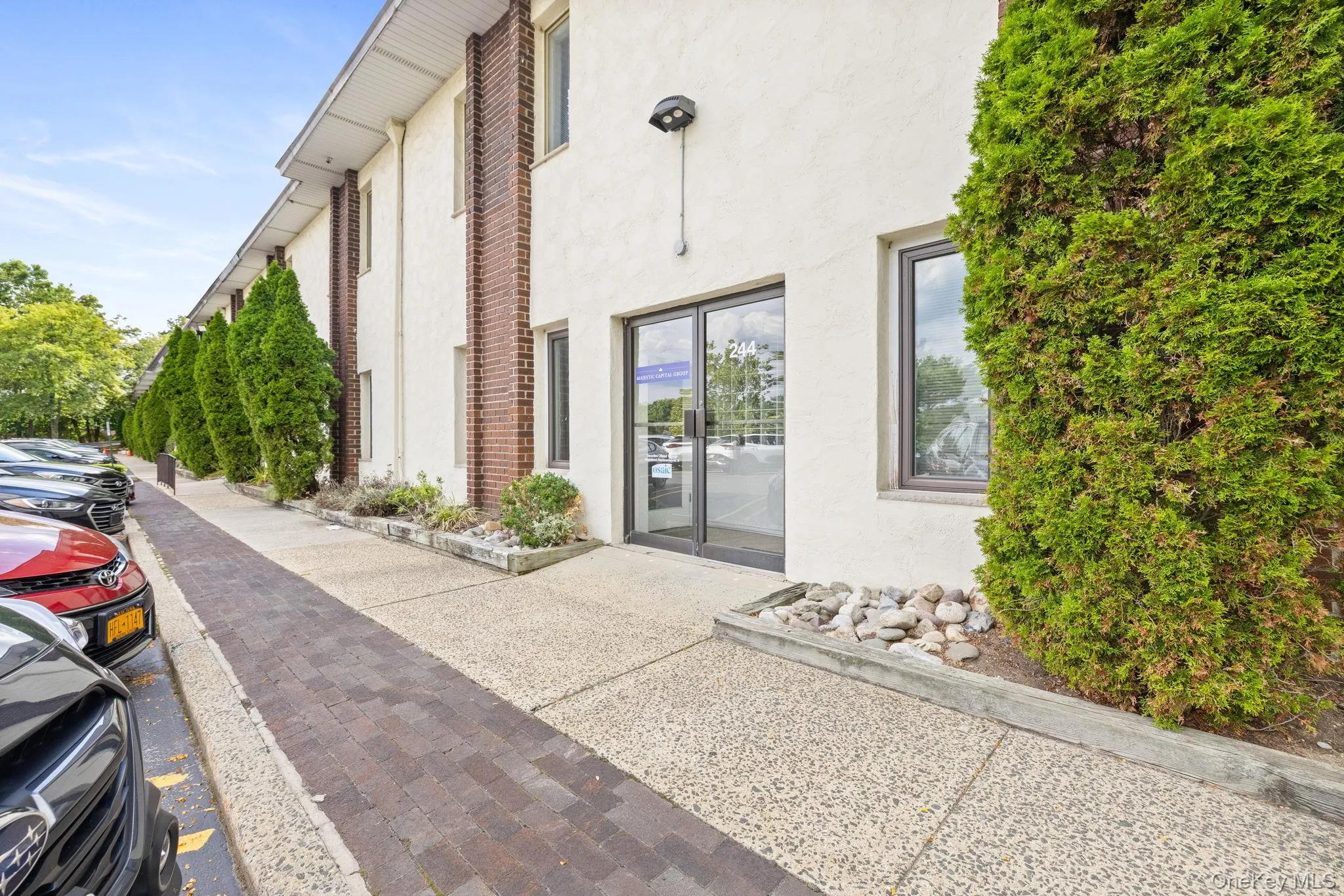 Property entrance with stucco siding Property entrance with stucco siding