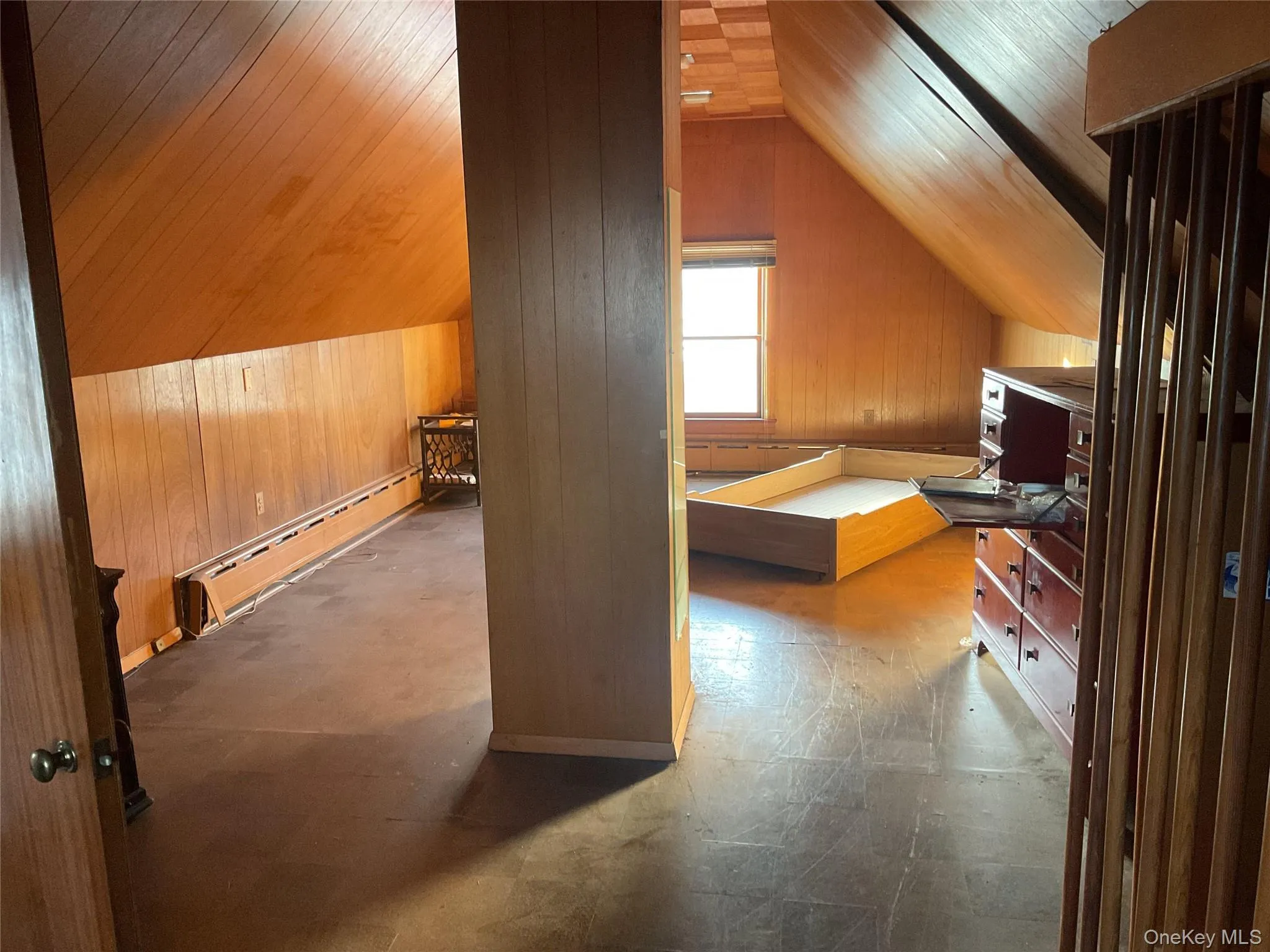 Additional living space featuring wood walls, a baseboard heating unit, vaulted ceiling, wooden ceiling, and tile patterned floors Additional living space featuring wood walls, a baseboard heating unit, vaulted ceiling, wooden ceiling, and tile patterned floors