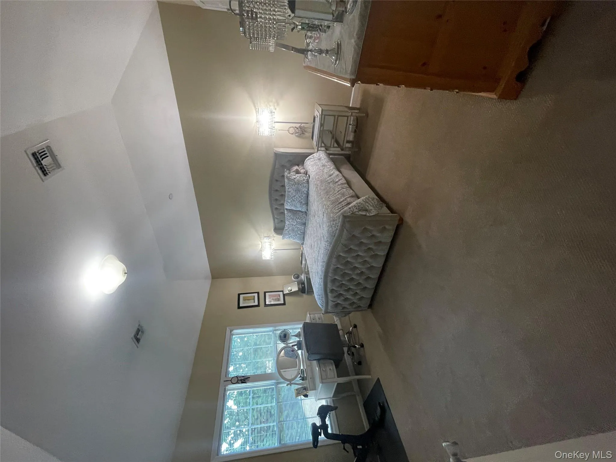 Bedroom featuring carpet floors and vaulted ceiling Bedroom featuring carpet floors and vaulted ceiling