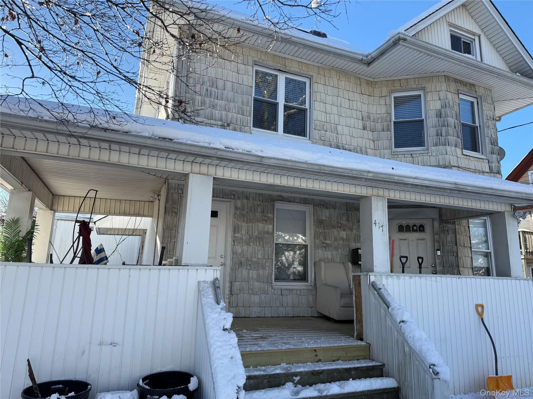 View of front of property with a porch and stairs View of front of property with a porch and stairs
