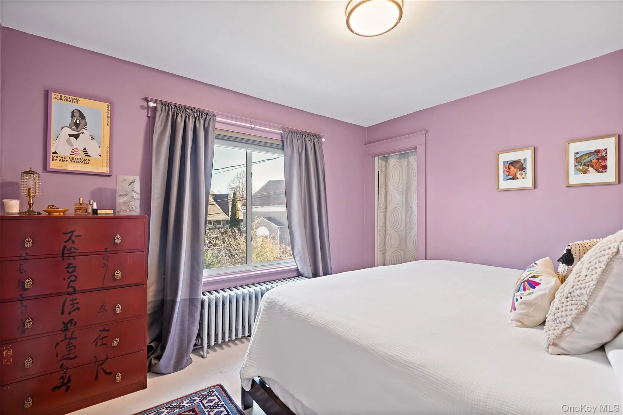 Primary bedroom featuring 2 walk in closets with windows Primary bedroom featuring 2 walk in closets with windows